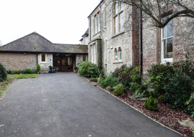 The outside front and main entrance of Loose Valley Care Home.