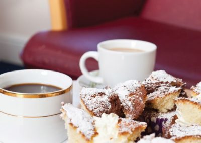Relax with a hot drink and a cake in our Visitors Lounge at Lukestone Care Home.