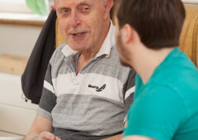 Our Activities Co-ordinator Dominic having a chat with one of our residents.