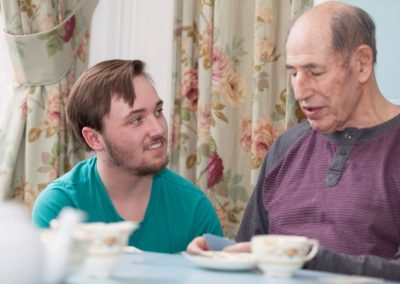 Our Activities Co-ordinator Dominic having a chat with one of our residents.