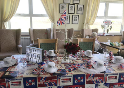 A table at Silverpoint Court laid with decorations and Union Jack flags for the Royal Wedding