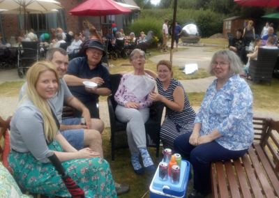 A resident with family at the Hengist Field Care Home summer BBQ