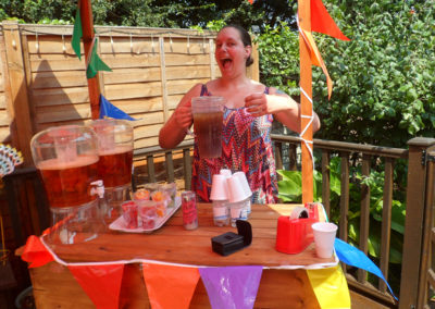 St Winifreds staff member serving Pimms and refreshing drinks