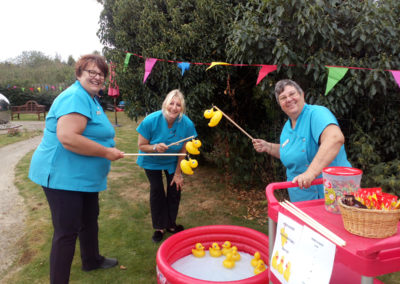The Recreation & Well-Being team at Hengist Field Care Home playing Hook A Duck