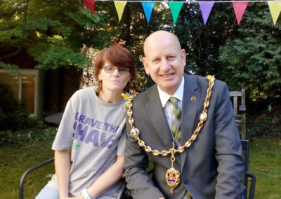 Loose Valley staff member posing for the camera with local Mayor Councillor David Naghi in the garden
