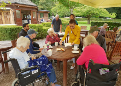 Lukestone Care Home residents enjoying a tea break with a slice of cake
