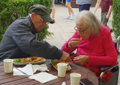 Lukestone Care Home residents enjoying fish and chips for lunch