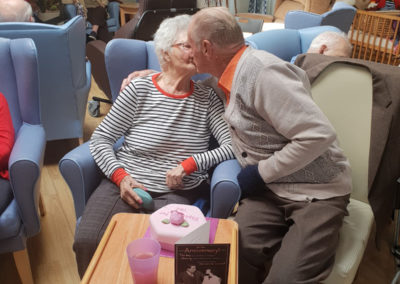 Joan Fellows and Ray kissing as they celebrate their 64th wedding anniversary