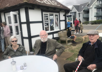Residents from Lulworth House sitting outside a Whistable cafe about to go home