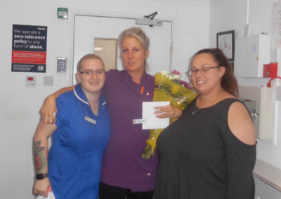 Woodstock Team Leaders wishing Domestic Assistant Carly a fond farewell