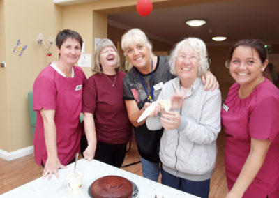 Viv Stead at Princess Christian Care Home icing cakes with residents