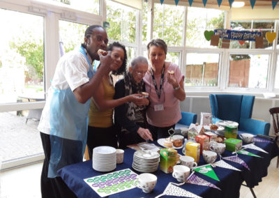 Viv Stead at Bromley Park Care Home tasting cakes with staff and residents