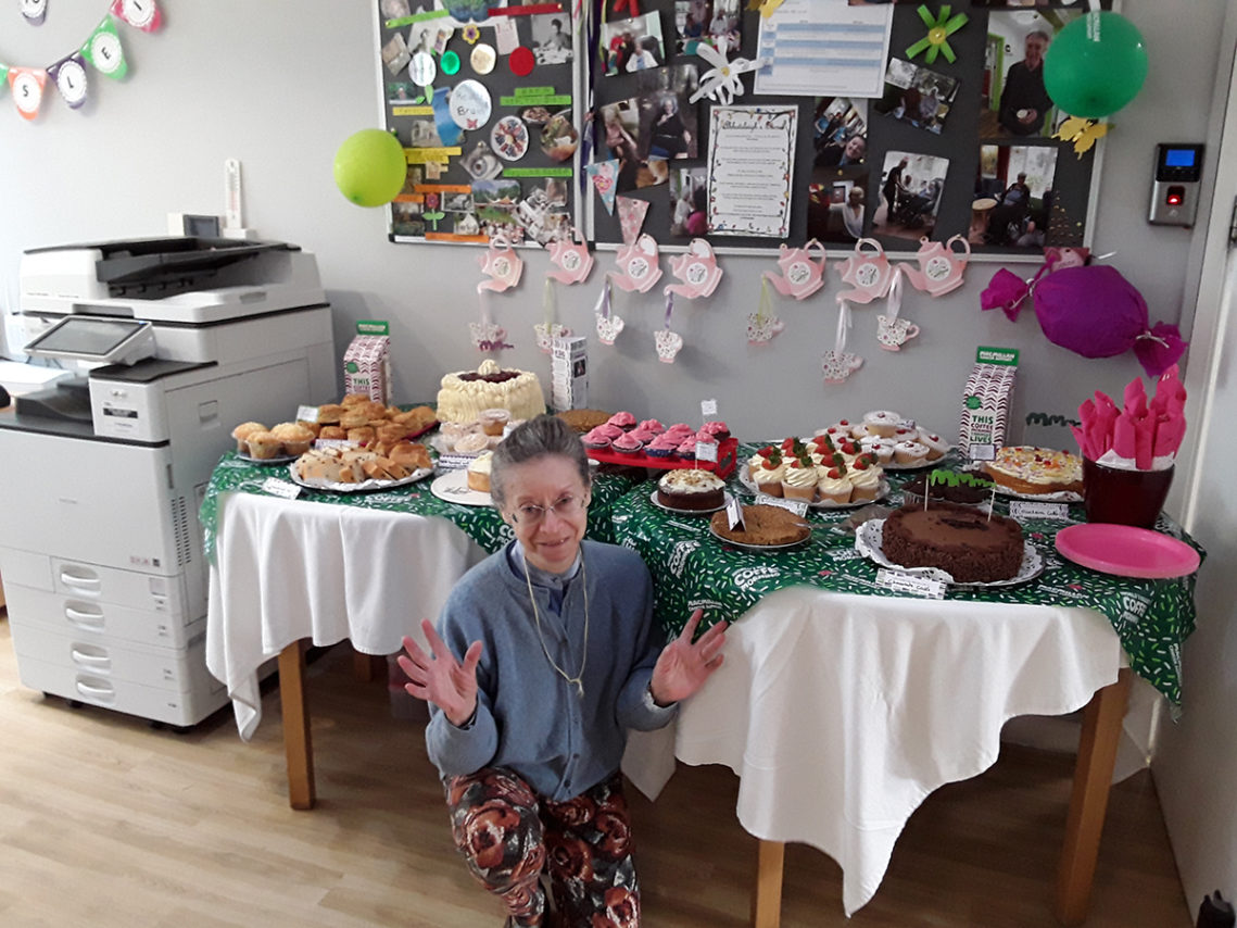 Abbotsleigh Care Home resident by the cakes table during the Macmillan Coffee Morning