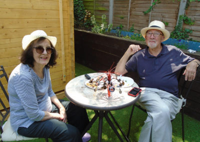 Residents, family and friends at Lulworth House enjoying a summer BBQ in the garden