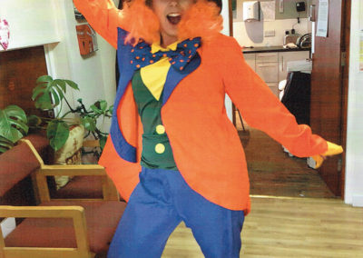 Meyer House Care Home staff member dressed in colourful Mad Hatter costume