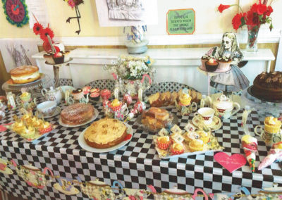 The impressive Mad Hatter's Tea Party cake table at Meyer House Care Home