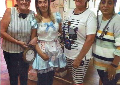 Gill Redsell and staff team at Meyer House Care Home dressed in Alicein Wonderland costumes