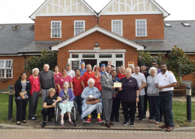 Th staff team and residents at Princess Christian Care Home proudly presenting the GSF award