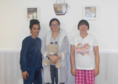 Three members of staff at Woodstock Residential Care Home wearing pyjamas for the day to raise money for The Alzheimer's Society