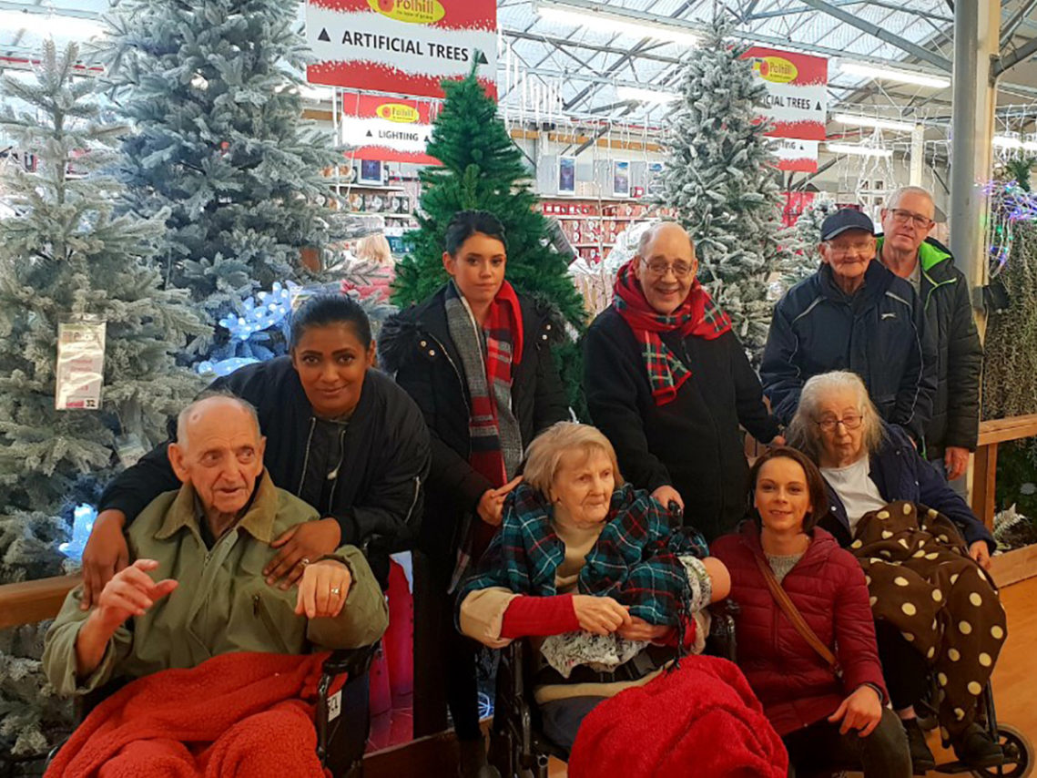 Lukestone Care Home residents by the Christmas trees at Polhill Garden Centre