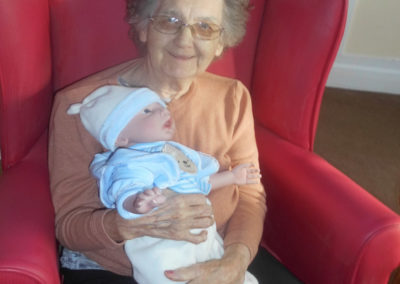 Woodstock Residential Care Home resident with one of the Therapy Dolls from Milton Regis Conservative Club