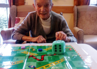 Hengist Field resident enjoying a game of giant snakes and ladders