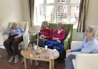 Lulworth House Residential Care Home residents socialising with drinks