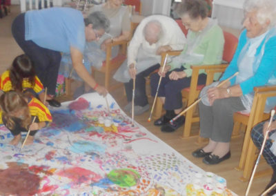 Squirrel Lodge Nursery painting with residents at Woodstock Residential Care Home