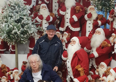 Lukestone Care Home residents by a display of Santas at Polhill Garden Centre