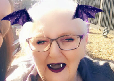 Meyer House resident with purple hair, fangs and bat ears
