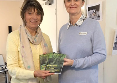 Author Sylvia Bryden-Stock presenting her books to a member of staff at Lulworth House