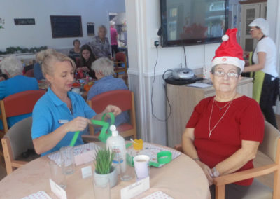 Residents making Christmassy paper chains to decorate Woodstock