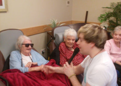 Singer Fred Clark singing to residents at Hengist Field Care Home in the lounge