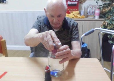 Male Woodstock resident making a personalise snow globe