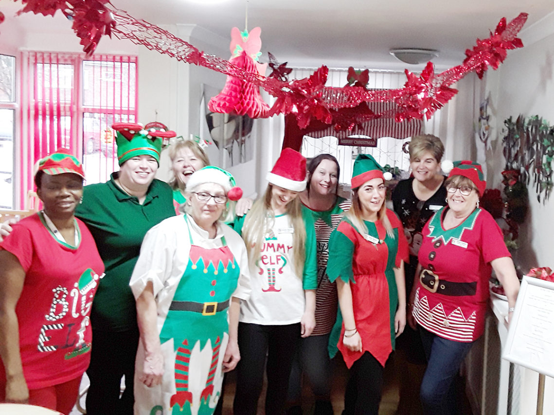 The staff team at Meyer House Care Home in elf fancy dress