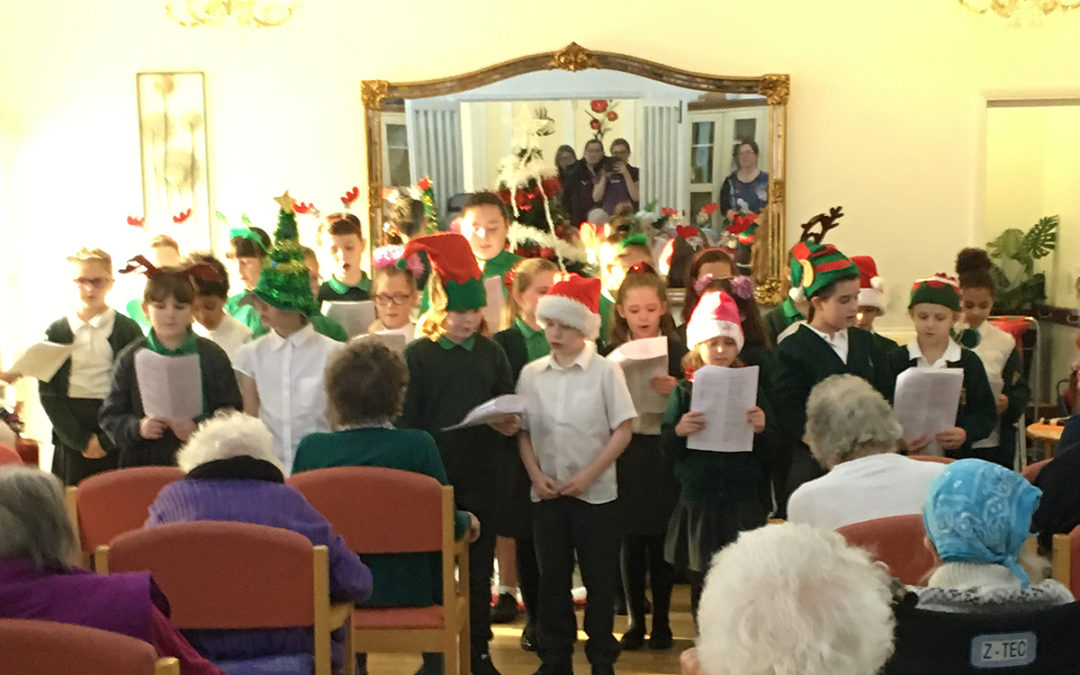 Minterne School Choir sing for residents at Woodstock Residential Care Home