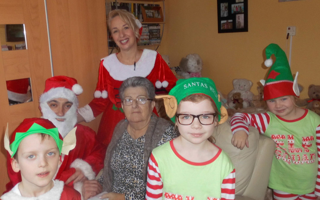 Father Christmas and his elves at Woodstock Residential Care Home