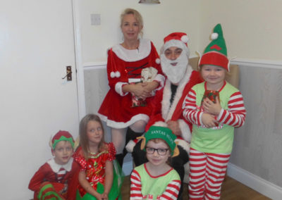 Father Christmas and his elves at Woodstock Residential Care Home (3 of 3)