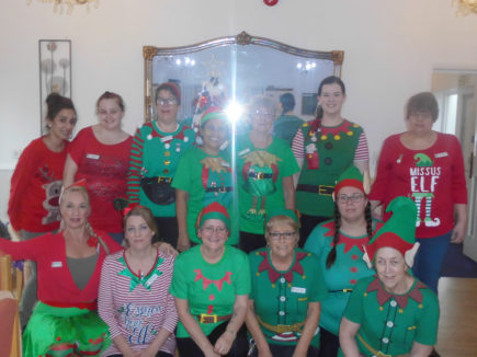 Woodstock Residential Care Home staff team dressed up Christmas elves costumes
