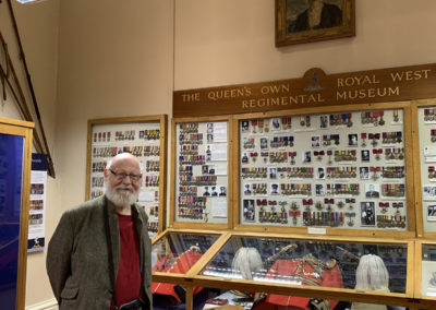 Lulworth make resident looking at royal medals in Maidstone Museum