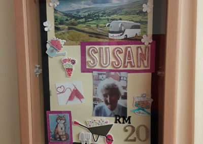 Resident Susan's memory box containing old photos and candles