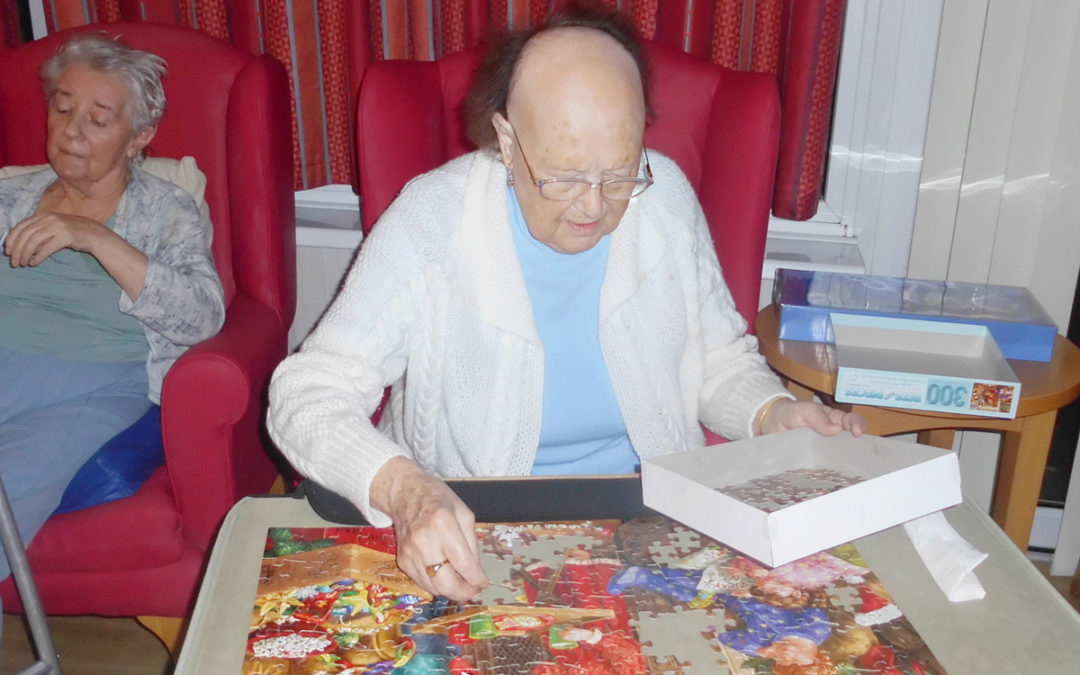 Doing Christmas puzzles at Woodstock Residential Care Home