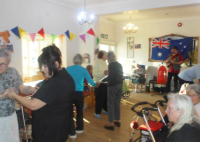 Woodstock Residential Care Home residents dancing in their lounge to music performed by musician Rob T
