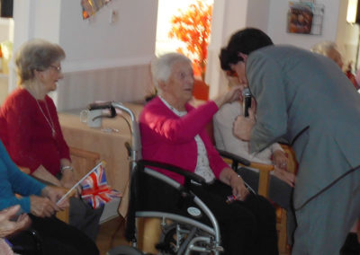 Entertainer Chris singing to residents at Woodstock Residential Care Home