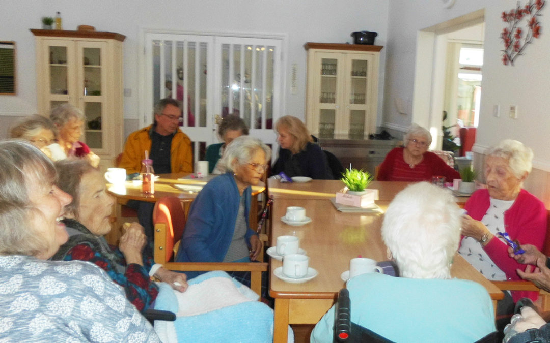 Residents and family meeting at Woodstock Residential Care Home
