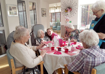 A group of ladies at The Old Downs busy making Valentine's Day crafts