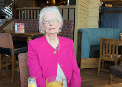 One of the Lulworth House residents enjoying a relaxing drink with her pub lunch