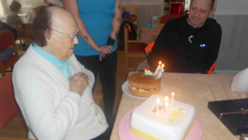 Resident Enid with her family at Woodstock Residential Care Home on her birthday