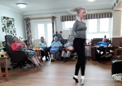 An Irish dancer performs in the lounge at Meyer House