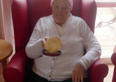 Residents flipping pancakes at Woodstock Residential Care Home 3